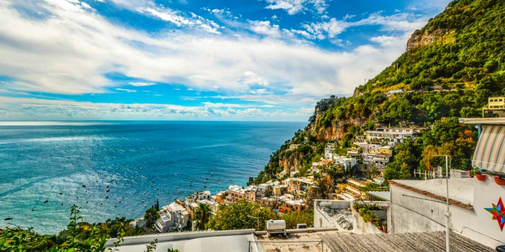 Iconic view of Positano on the Amalfi Coast with colorful houses cascading down the cliff