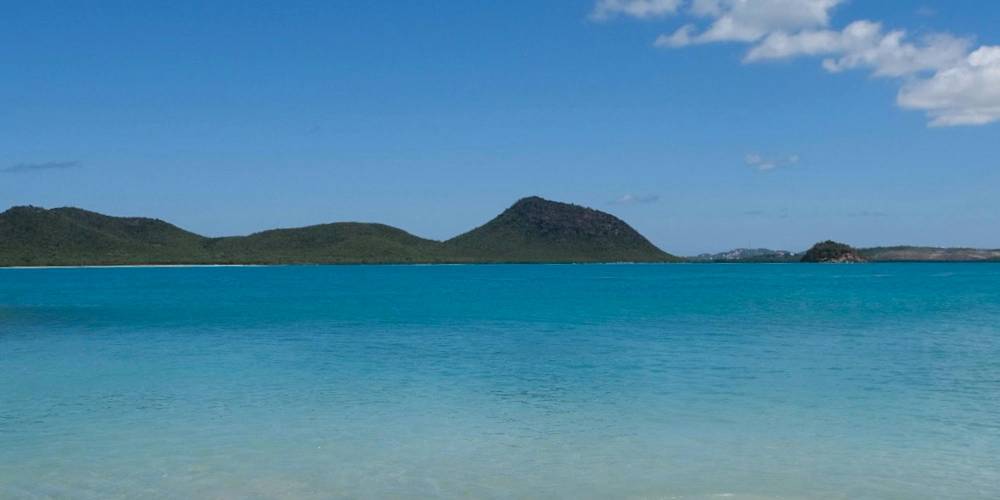 A stunning white sand beach with clear turquoise water in Antigua