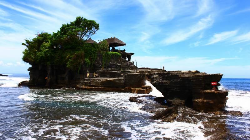 The iconic Tanah Lot sea temple in Bali at sunset