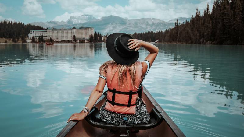 People canoeing on the stunning turquoise waters of Lake Louise in Banff National Park