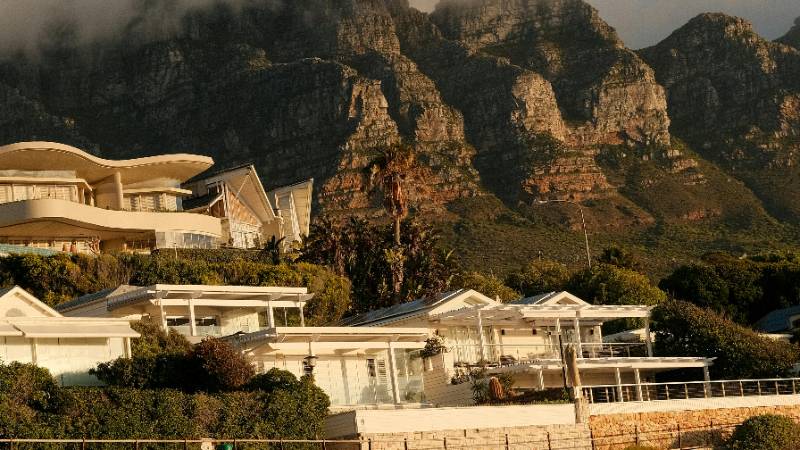Beautiful Camps Bay beach in Cape Town with the Twelve Apostles mountain range
