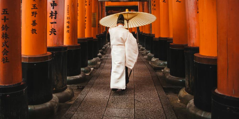 Thousands of vibrant red torii gates at Fushimi Inari Shrine in Kyoto, Japan