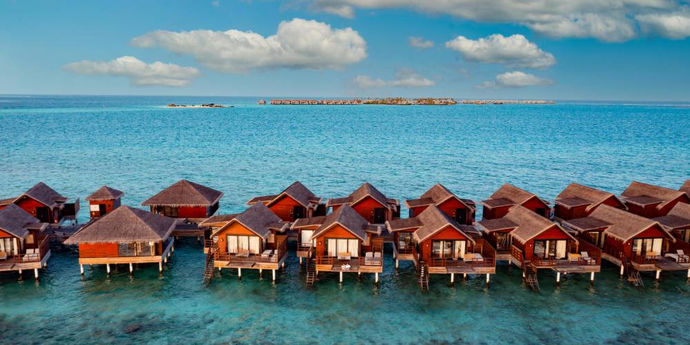 Aerial view of luxurious overwater bungalows in the Maldives