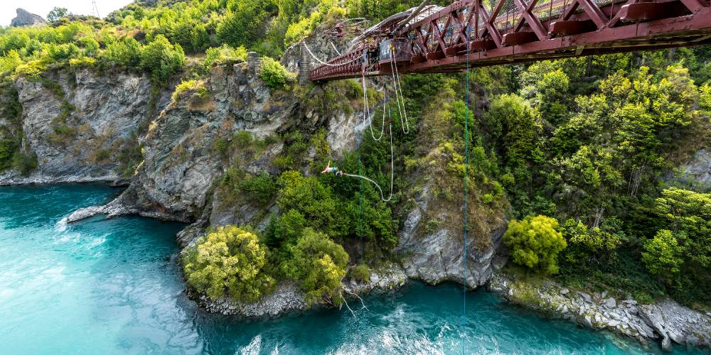 A thrill-seeker bungee jumping from the historic Kawarau Bridge in Queenstown, New Zealand