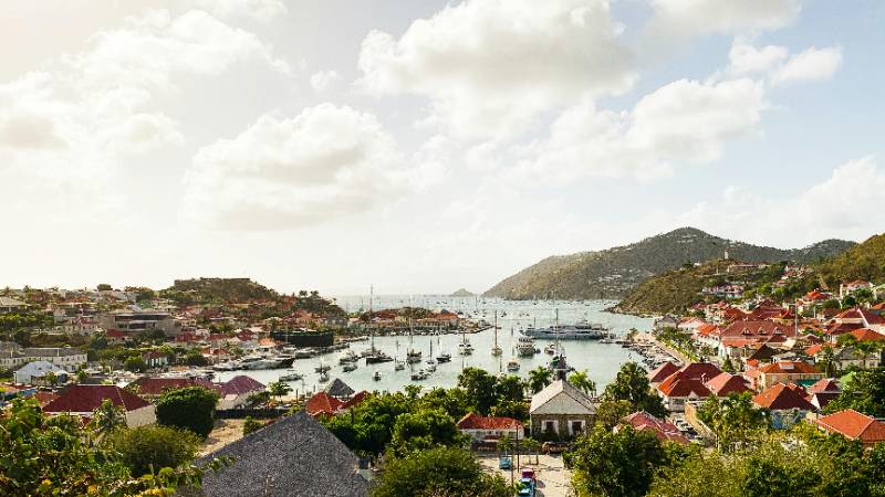 The picturesque harbor of Gustavia, St. Barts, filled with luxury yachts