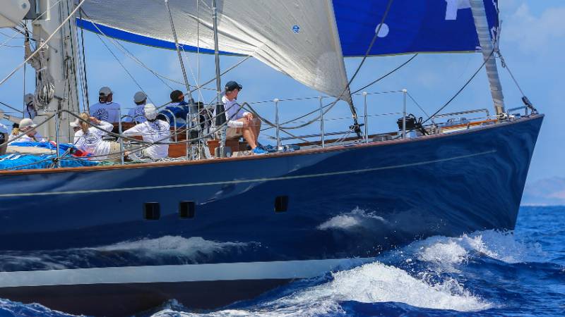 A luxury yacht cruising in the turquoise waters of St. Barts