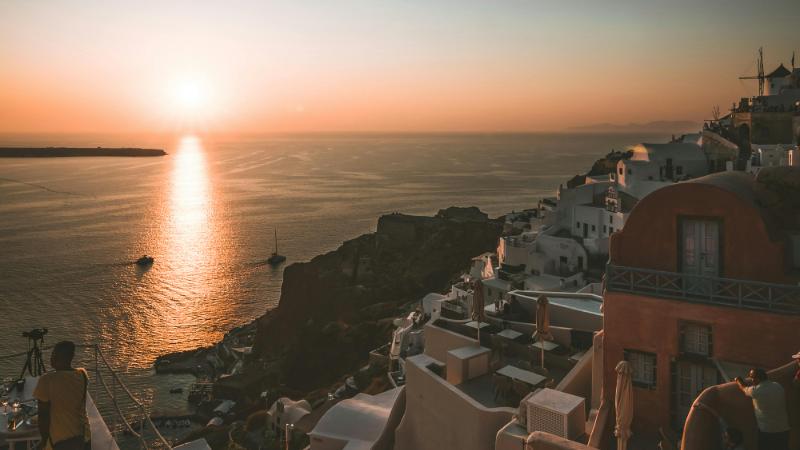 Spectacular sunset view from Oia, Santorini, over the caldera