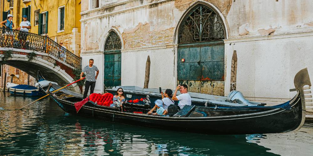 Romantic gondola ride along a picturesque canal in Venice, Italy